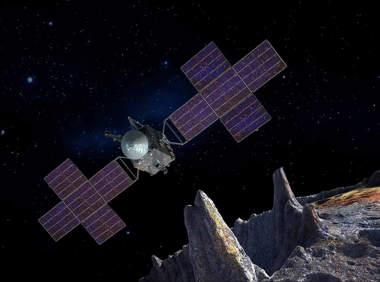 Artist’s concept of Psyche approaching the asteroid with its large solar arrays