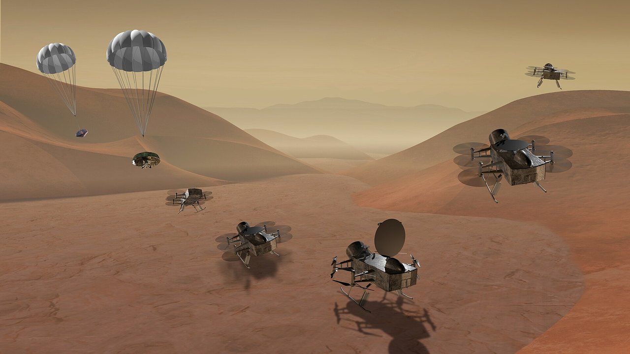 Artist’s concept of Dragonfly exploring landing sites beneath Titan’s orange sky