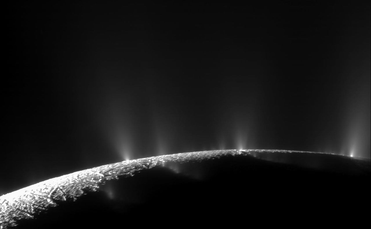 Backlit geysers erupting along the south-polar fractures